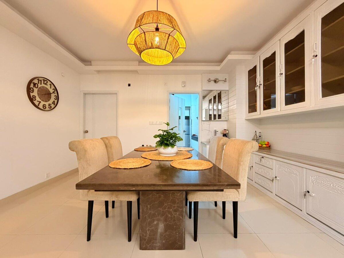 Dining room under a woven rattan pendant