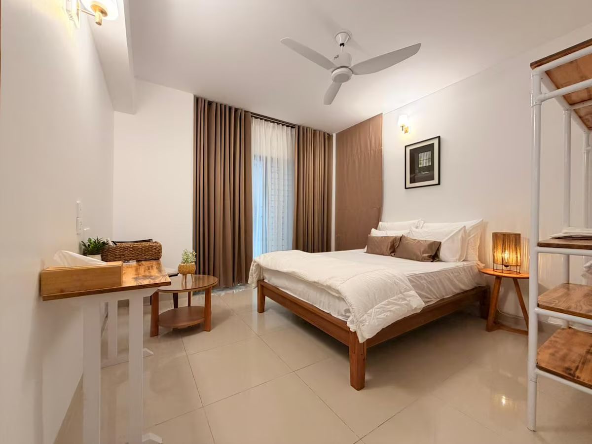 Main bedroom Bedroom with a timber bed and warm lamps