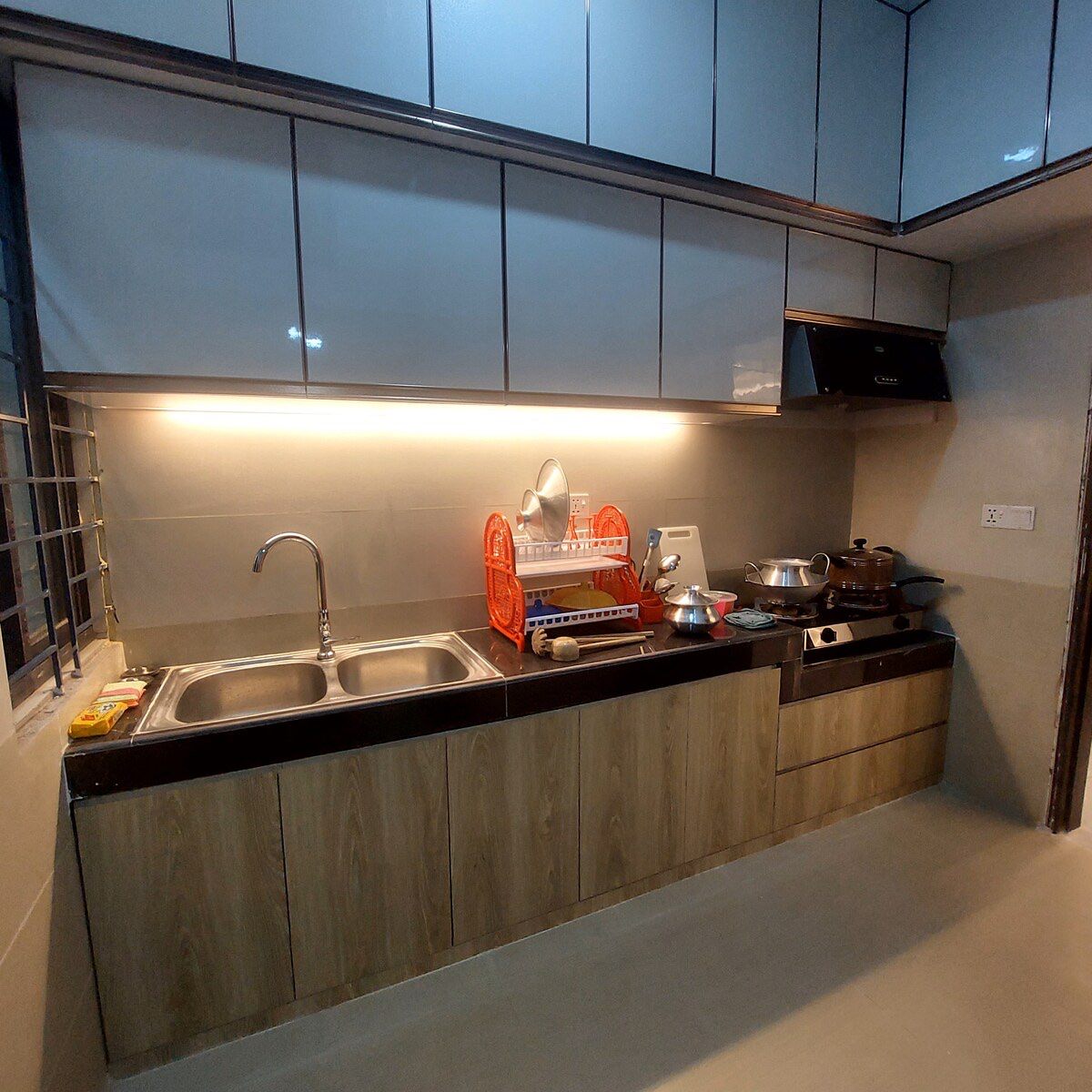 Kitchen Kitchen with dark cabinets and under-cabinet lights