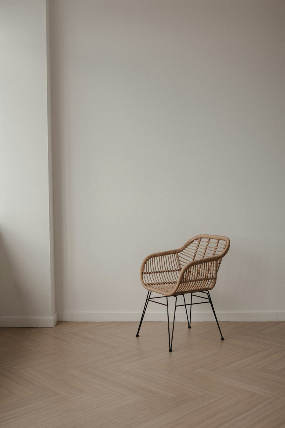 Woven rattan chair on oak floor